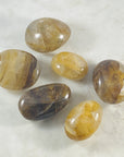 golden healer quartz palm stone by sarah belle