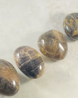 Black moonstone palm stone for meditation