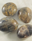 Black moonstone palm stone for meditation
