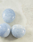 blue calcite palm stones for healing from sarah belle