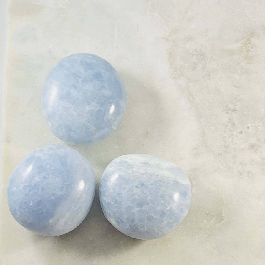 blue calcite palm stones for healing from sarah belle