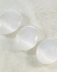 Selenite palm stone by Sarah Belle