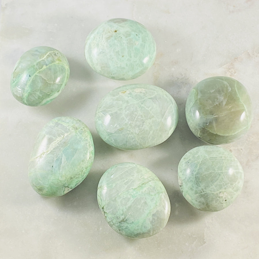 green moonstone palm stone for heart chakra 