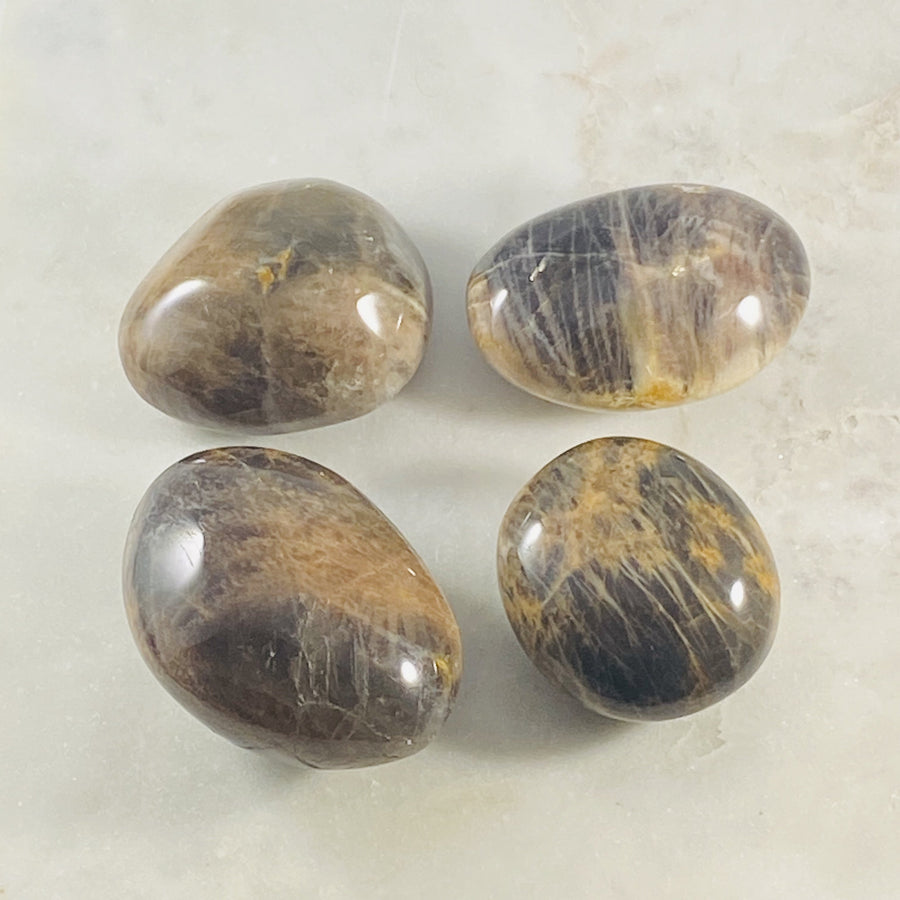 Black moonstone palm stone