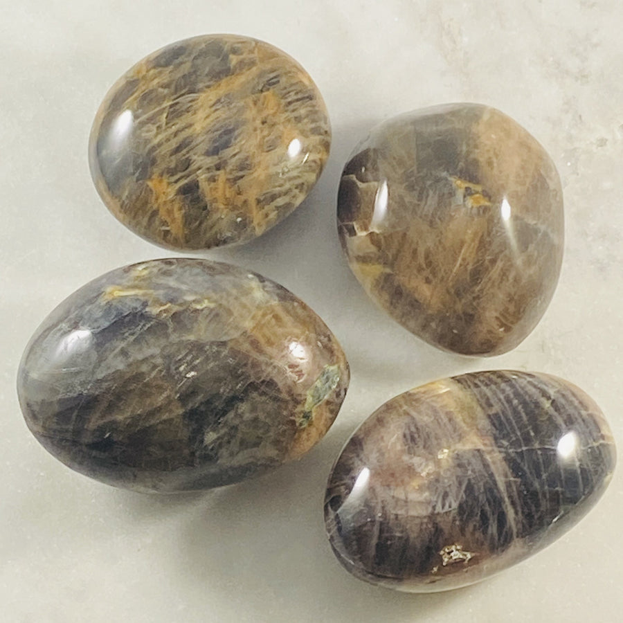 Black moonstone palm stone for meditation