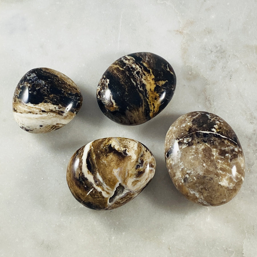 black opal palm stones for root chakra from sarah belle