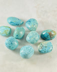 Chryscolla tumbled stone for energy healing, alleviating pain and guilt.