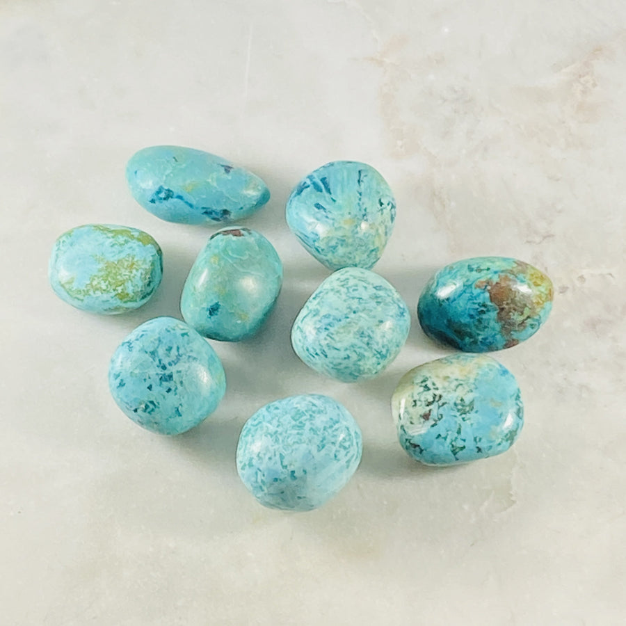 Chryscolla tumbled stone for energy healing, alleviating pain and guilt.