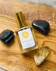 High frequency perfume bottled in the USA by Sarah Belle, the Queen crystal-infused eau de parfum features the frequencies of amber and gold sheen obsidian, and carries the energies of inner-reflection, personal power, fairness and luxury. Perfect for crystal lovers and makes the perfect gift.