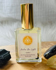 High frequency perfume bottled in the USA by Sarah Belle, the Queen crystal-infused eau de parfum features the frequencies of amber and gold sheen obsidian, and carries the energies of inner-reflection, personal power, fairness and luxury. Perfect for crystal lovers and makes the perfect gift.