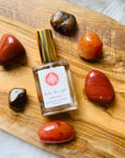 High frequency perfume bottled in the USA by Sarah Belle, the Transformation crystal-infused eau de parfum features the frequencies of red jasper, carnelian and tigers eye and carries the transformative energy of fire imparting a sense of empowerment, vitality and courage. Perfect for crystal lovers.