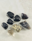 Jet tumbled stone by Sarah Belle with protective and purifying abilities.