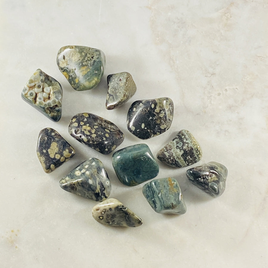 Ocean Jasper tumbled stone for grounding and healing crystal energy, useful for meditation.