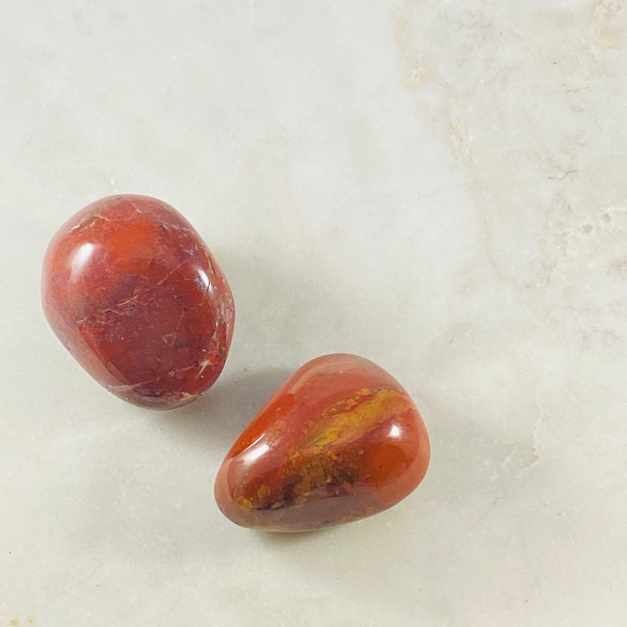 Red Jasper palm stone to empower the root chakra and for grounding energy.