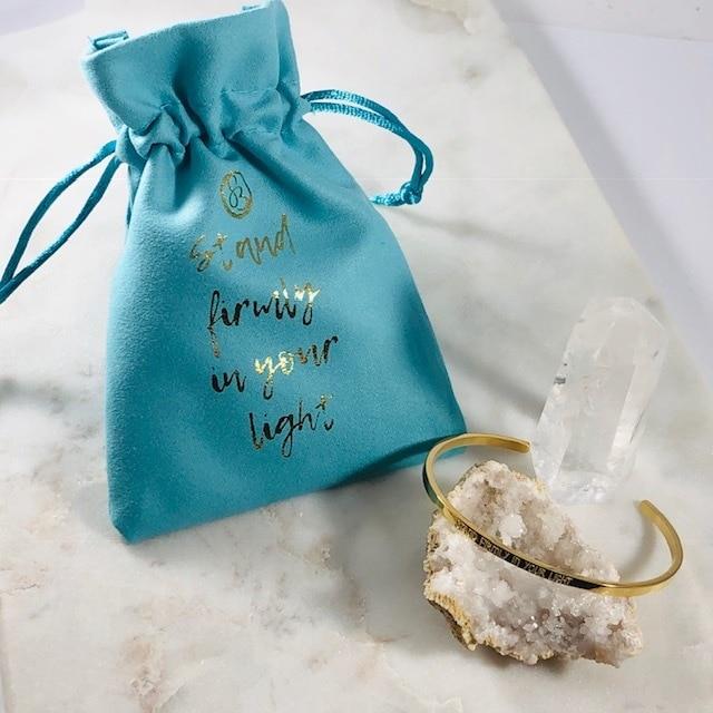 Mantra cuff bracelet with Stand Firmly in Your Light bag